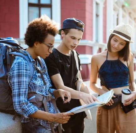 Student holding a passport and phone